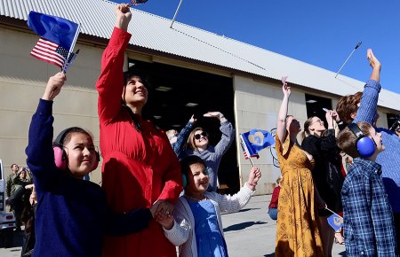Families and friends wave to the oncoming jets as they prepare to land on Wednesday afternoon at NAS Lemoore. 